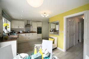Photo- black door/garage off plan launch for south Liverpool homes