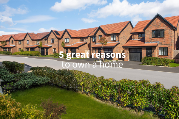 Image of new build homes, with people walking down the road in front of the houses