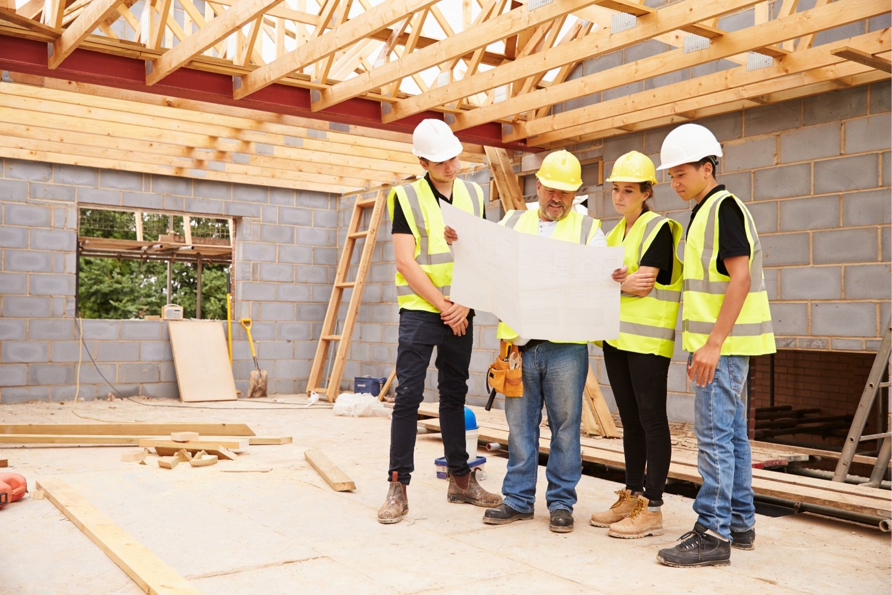 Couple viewing their new home mid construction