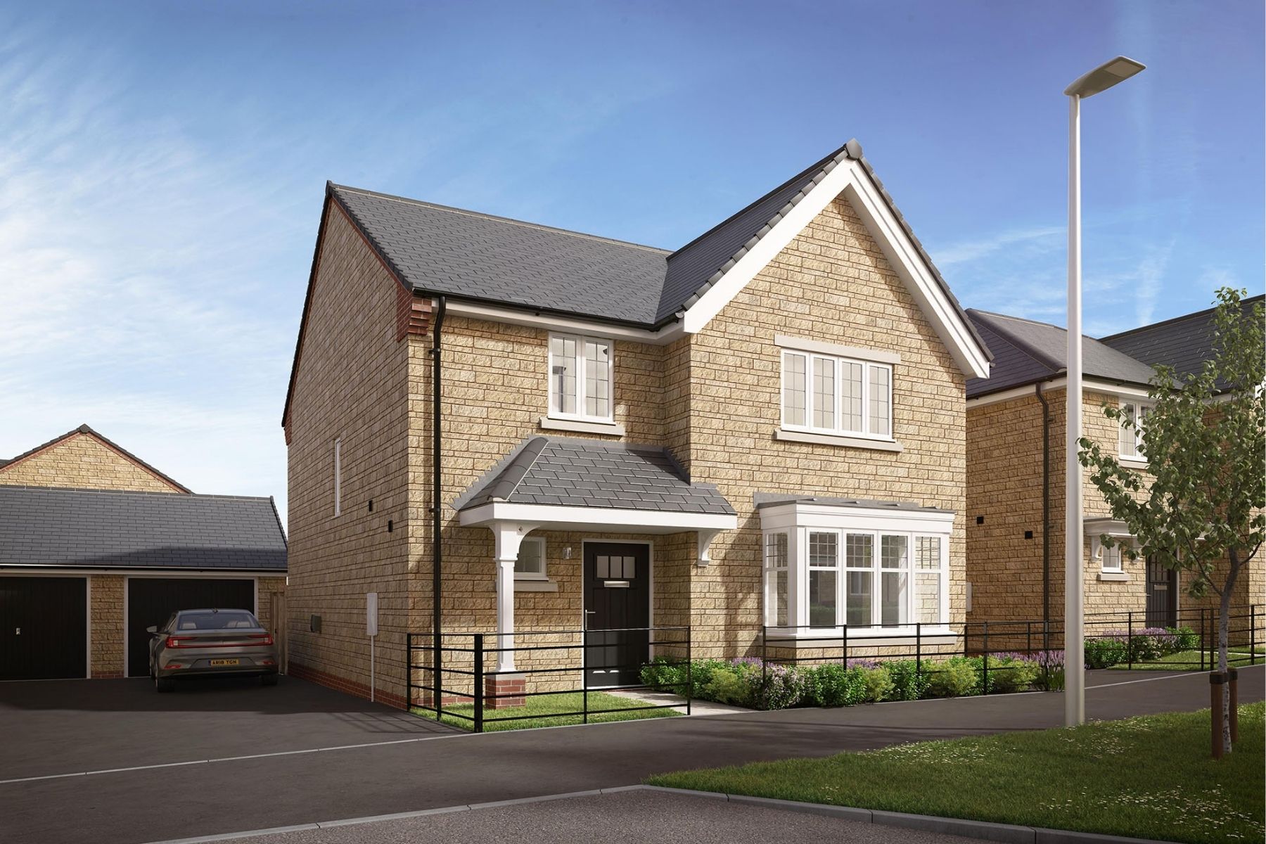 Cotswold stone detached homes at Avon Rise by Bloor Homes