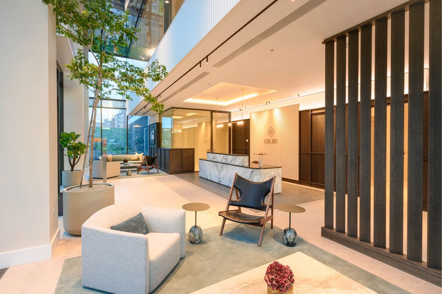 Entrance lounge with sofa and reception desk at Ebury